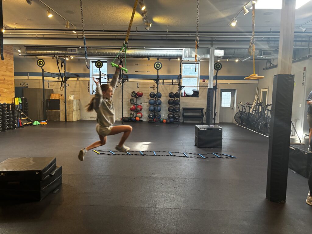 Athlete scaling through the obstacle course at ABL Fitness during the Ninja Fitness Class.