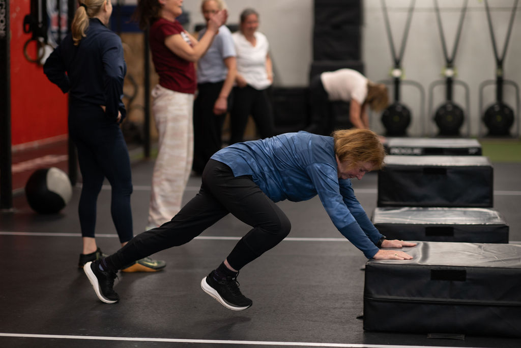 Older adult participating in medical fitness strength training at ABL Fitness