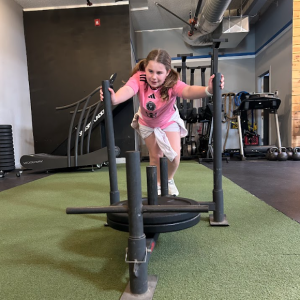 Athletes building coordination and functional fitness in adaptive group class