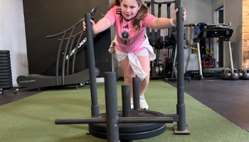 Athletes building coordination and functional fitness in adaptive group class