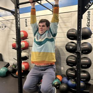 Teen athlete participating in adaptive fitness strength training at ABL Fitness